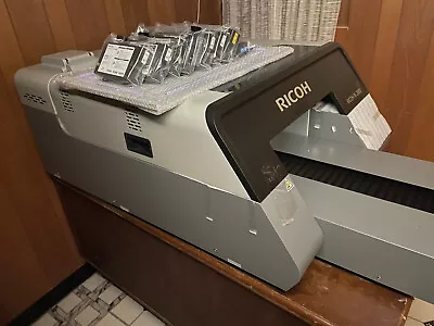 Buy DTG Printer Ricoh Ri 2000. Never Used. Includes Heat Press & Ink Cartridges • 17,500$